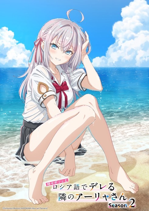 Alisa sitting in the water at the edge of the beach cooling off